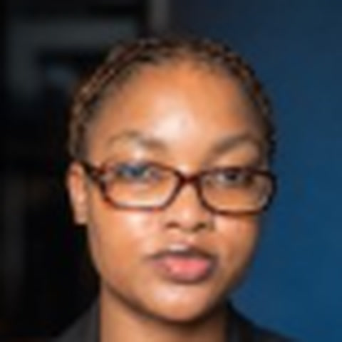 Busayo Aminata Agbaje in glasses, looking at the camera.